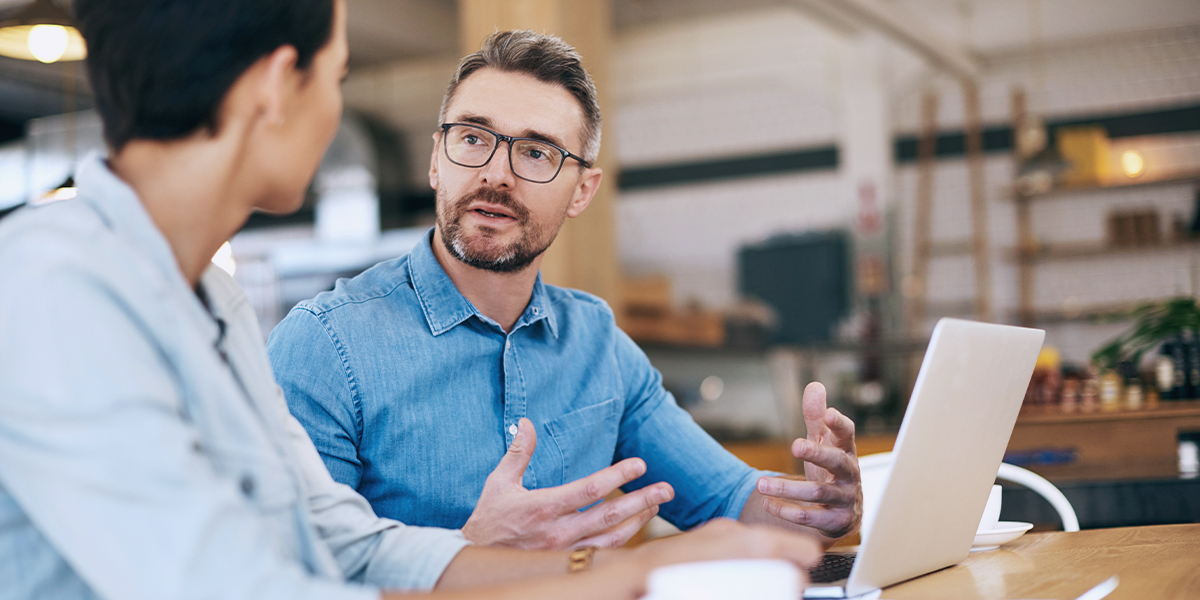 Man and woman discussing finance needs